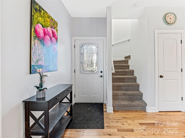 foyer with light hardwood / wood-style floors