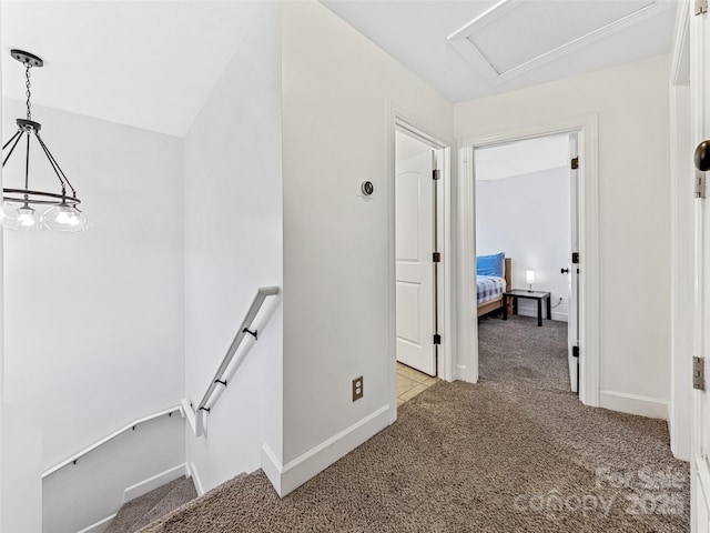 hall featuring light colored carpet