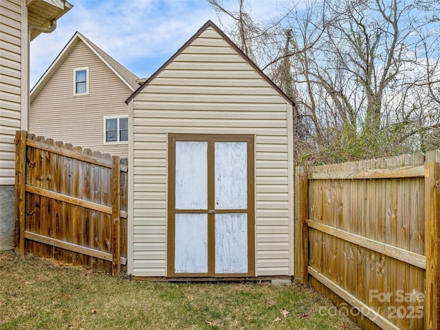 view of outbuilding featuring a yard