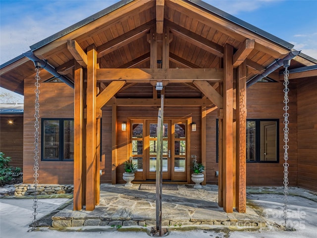 view of exterior entry featuring french doors