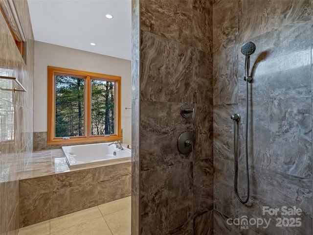 bathroom featuring tile patterned floors and independent shower and bath