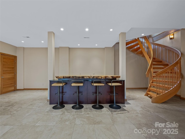 kitchen featuring a breakfast bar