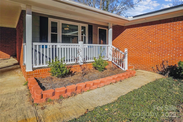 doorway to property featuring a porch