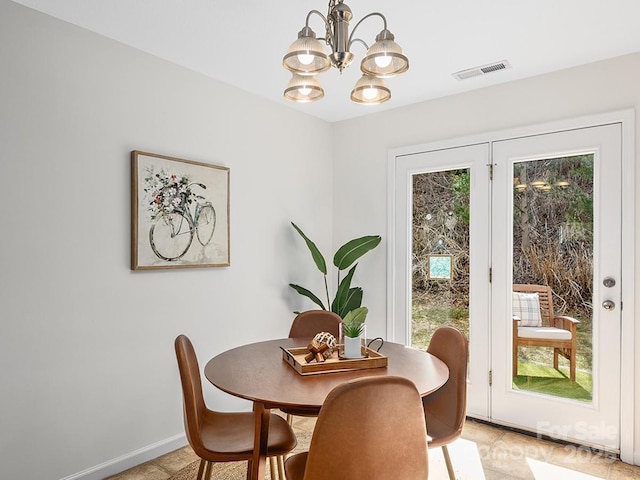 dining room featuring a notable chandelier