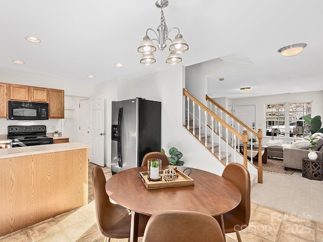 dining area featuring an inviting chandelier