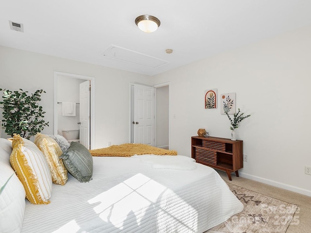 carpeted bedroom featuring connected bathroom