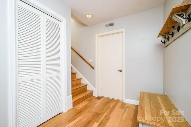 mudroom with light hardwood / wood-style flooring