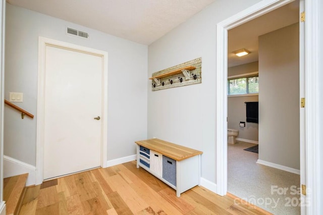 mudroom with light hardwood / wood-style floors