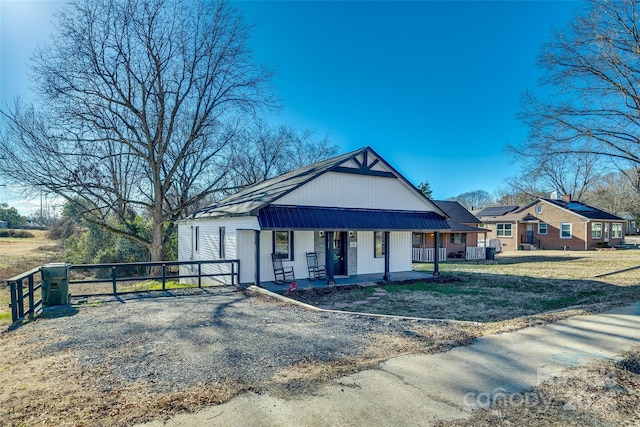 view of front facade with a porch and a front lawn