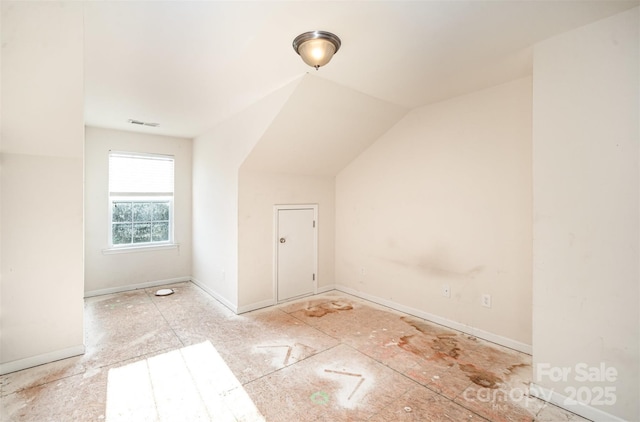 bonus room featuring lofted ceiling