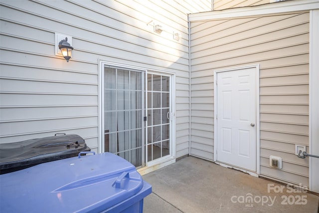 property entrance with a patio area