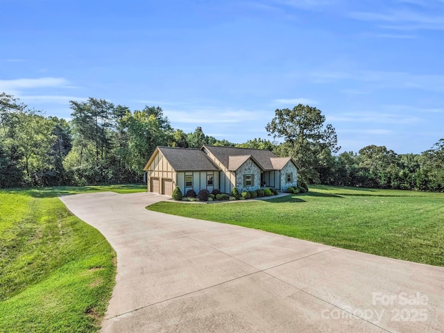 view of front of house with a garage and a front lawn