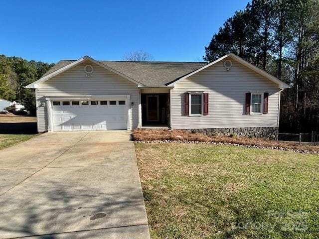 ranch-style home with a front lawn and a garage