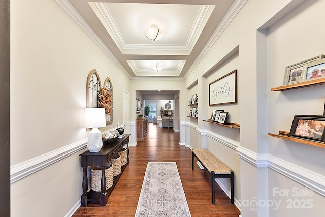 corridor featuring dark hardwood / wood-style flooring and crown molding