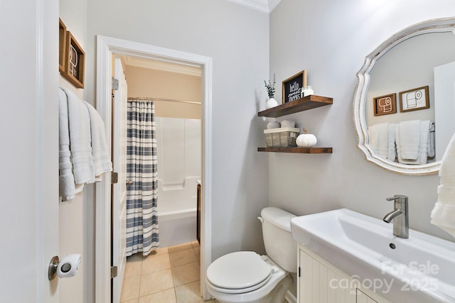 full bathroom with tile patterned flooring, crown molding, toilet, vanity, and shower / tub combo