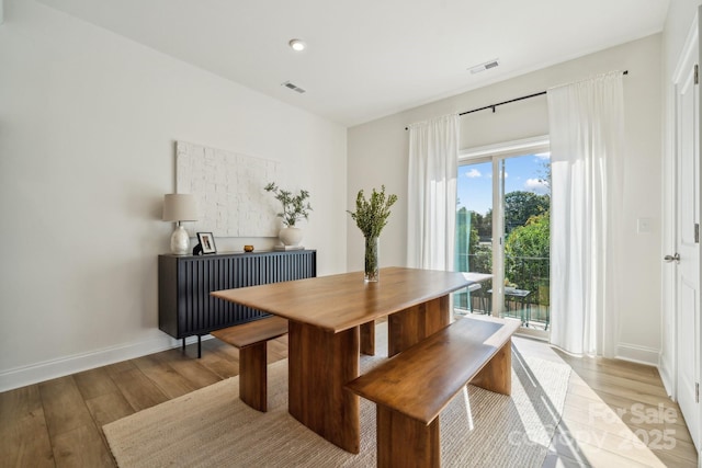 dining area with light wood-type flooring