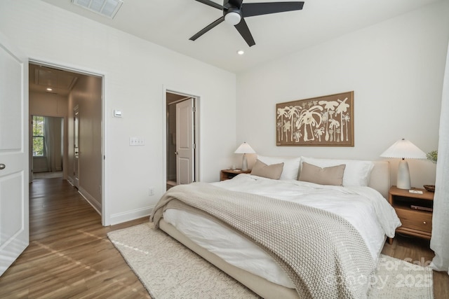 bedroom featuring ceiling fan and hardwood / wood-style flooring