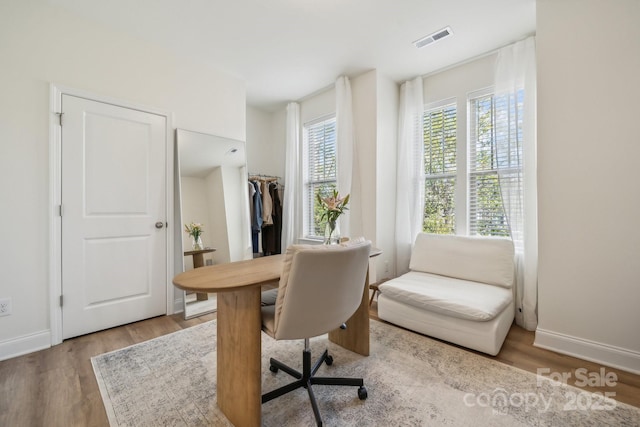 office area with light hardwood / wood-style floors