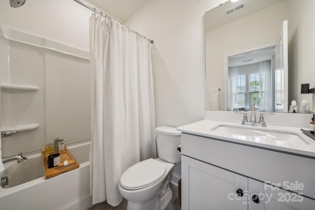 full bathroom with shower / bath combo with shower curtain, toilet, and vanity