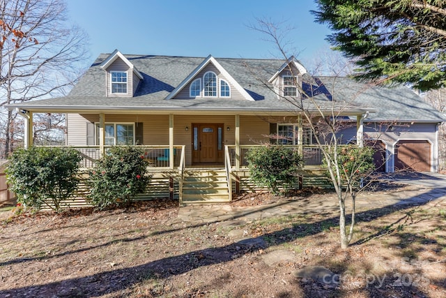 cape cod-style house featuring covered porch