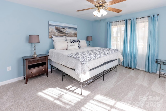 bedroom with light carpet and ceiling fan