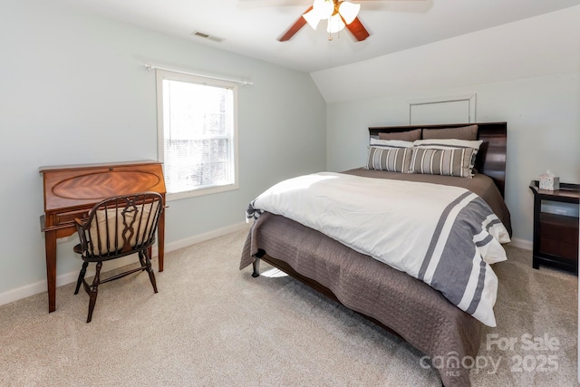 carpeted bedroom with vaulted ceiling and ceiling fan