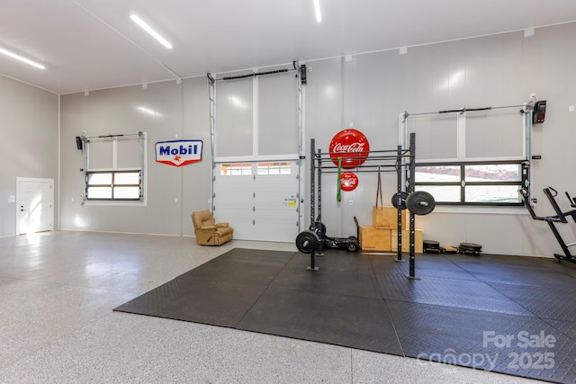 workout room with plenty of natural light