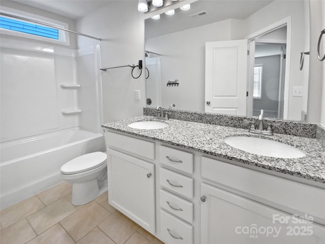 full bathroom with tile patterned flooring, shower / bathing tub combination, plenty of natural light, toilet, and vanity