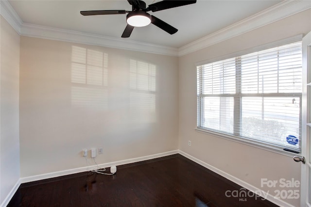 empty room with dark hardwood / wood-style flooring, ceiling fan, and crown molding