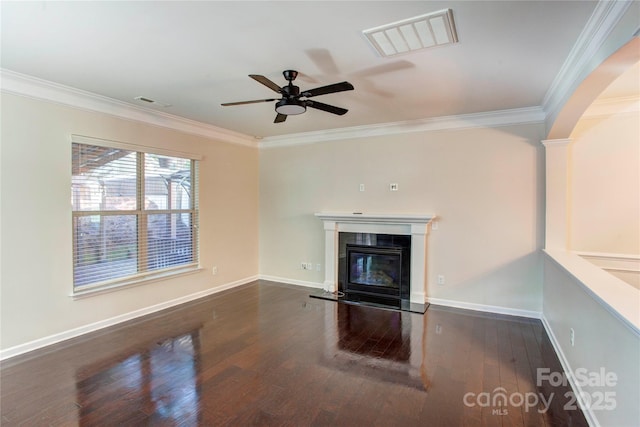 unfurnished living room featuring ceiling fan, dark hardwood / wood-style flooring, and crown molding