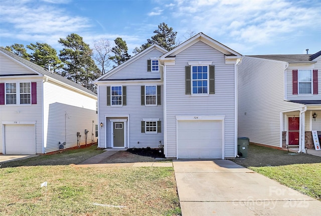 view of front property with a front yard and a garage