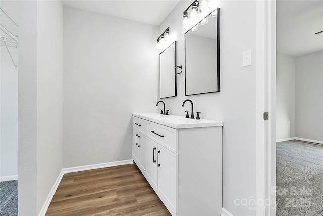 bathroom with vanity and wood-type flooring