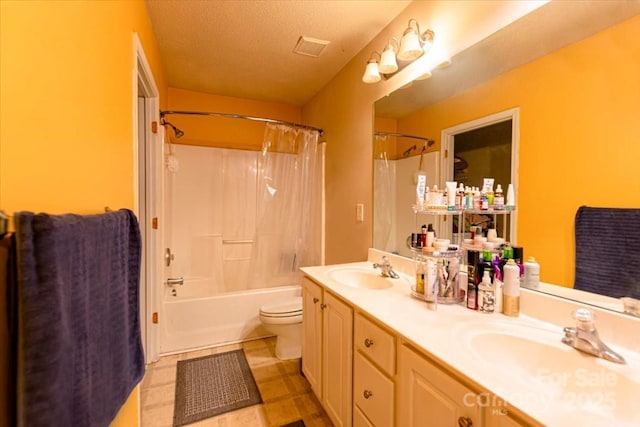 full bathroom featuring a textured ceiling, vanity, shower / tub combo, and toilet