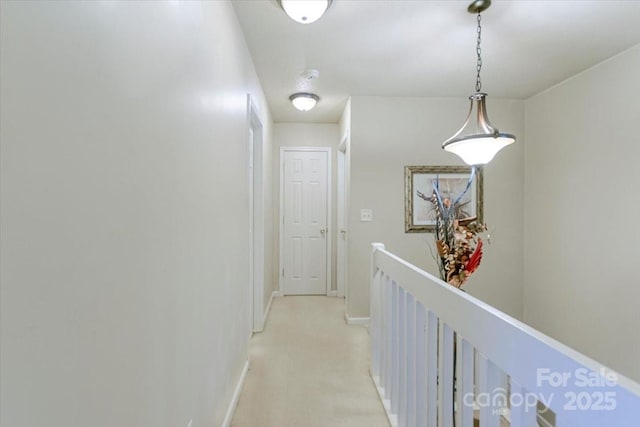 hallway featuring light carpet