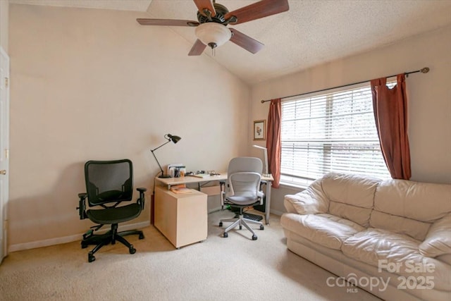 carpeted office featuring ceiling fan, a textured ceiling, and vaulted ceiling