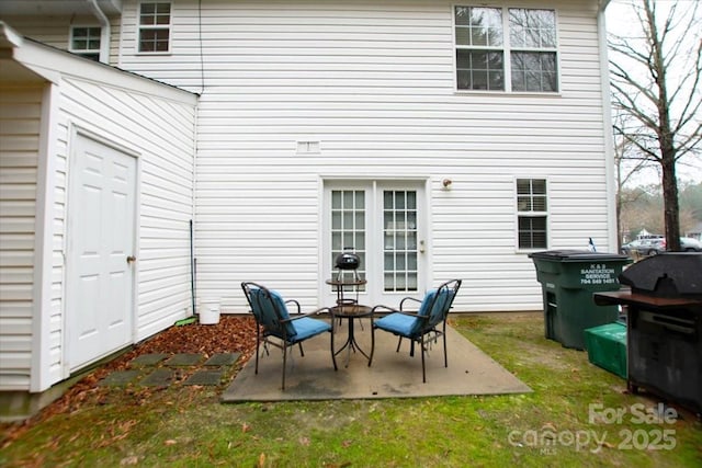 back of property with a patio