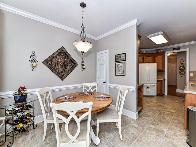 dining room featuring ornamental molding