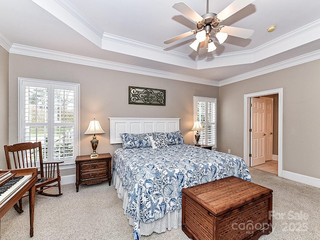 bedroom featuring light carpet, a raised ceiling, ceiling fan, and crown molding