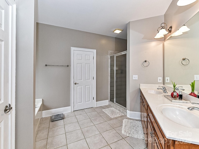 bathroom featuring tile patterned floors, vanity, and separate shower and tub