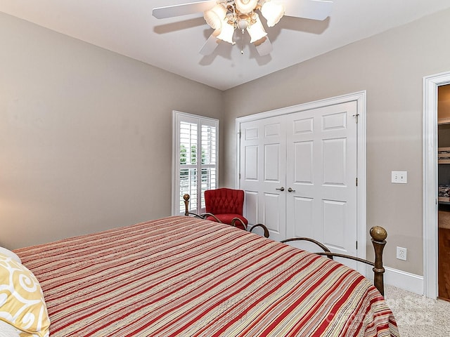 bedroom featuring carpet, a closet, and ceiling fan