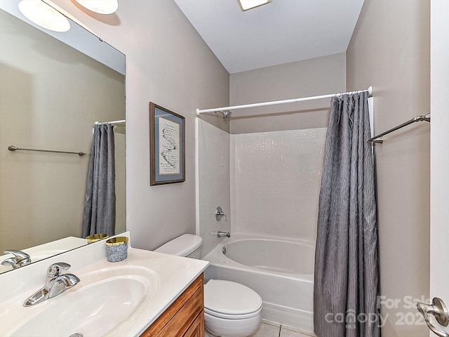 full bathroom with tile patterned flooring, shower / bath combination with curtain, vanity, and toilet