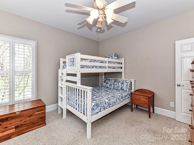 bedroom with multiple windows, carpet floors, and ceiling fan