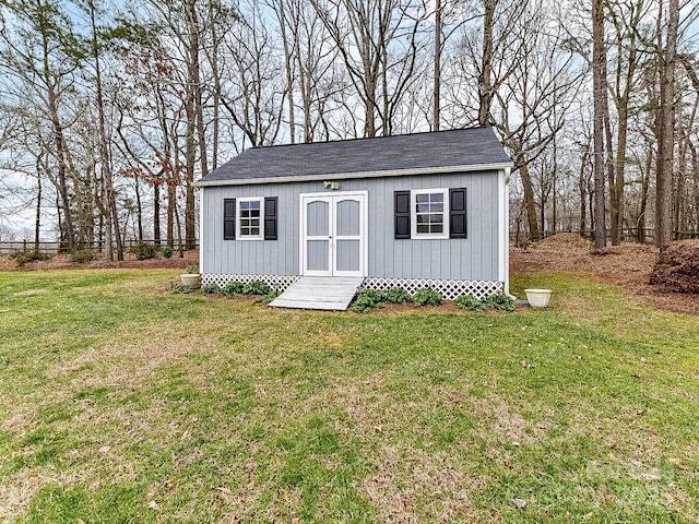 view of outdoor structure with a lawn