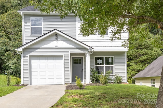 view of front of house featuring a front yard and a garage