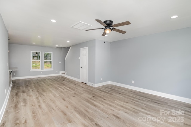 spare room with light hardwood / wood-style floors and ceiling fan