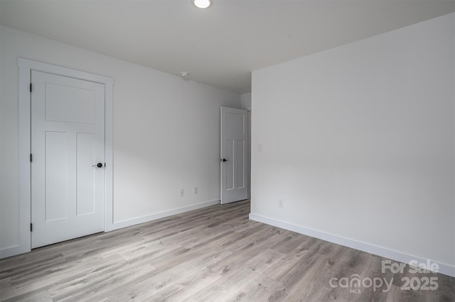 unfurnished room featuring light wood-type flooring