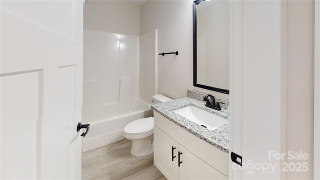 full bathroom with vanity, shower / bathtub combination, toilet, and wood-type flooring