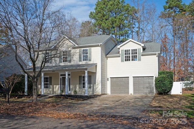 view of front of home featuring a porch and a garage