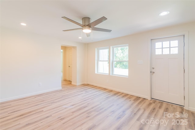 entryway featuring light hardwood / wood-style flooring and ceiling fan