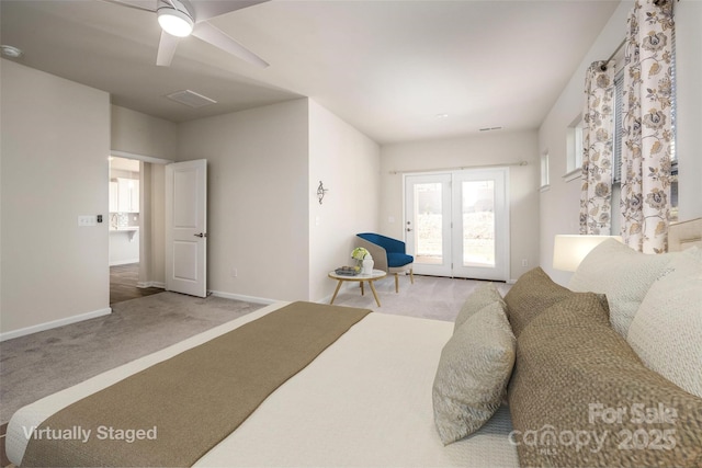 carpeted bedroom with ceiling fan and french doors